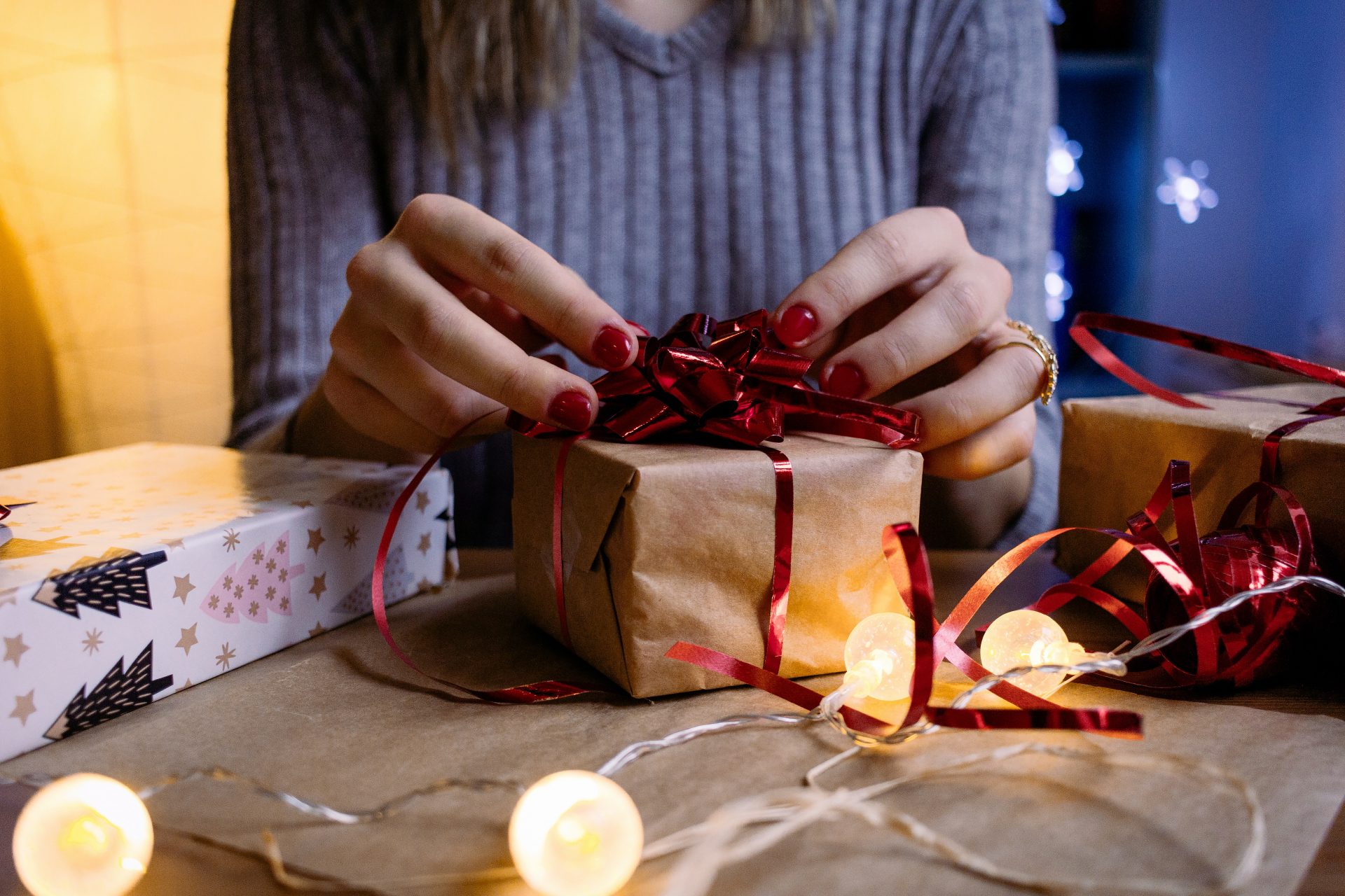 woman wrapping gift